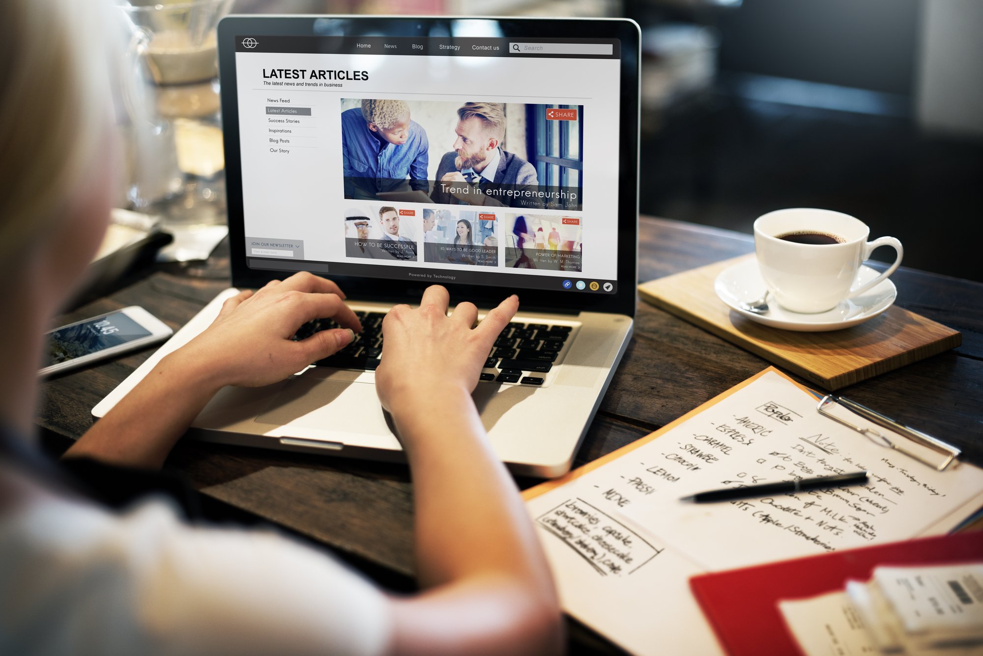 Update your website like this person updating their website with a new blog post.